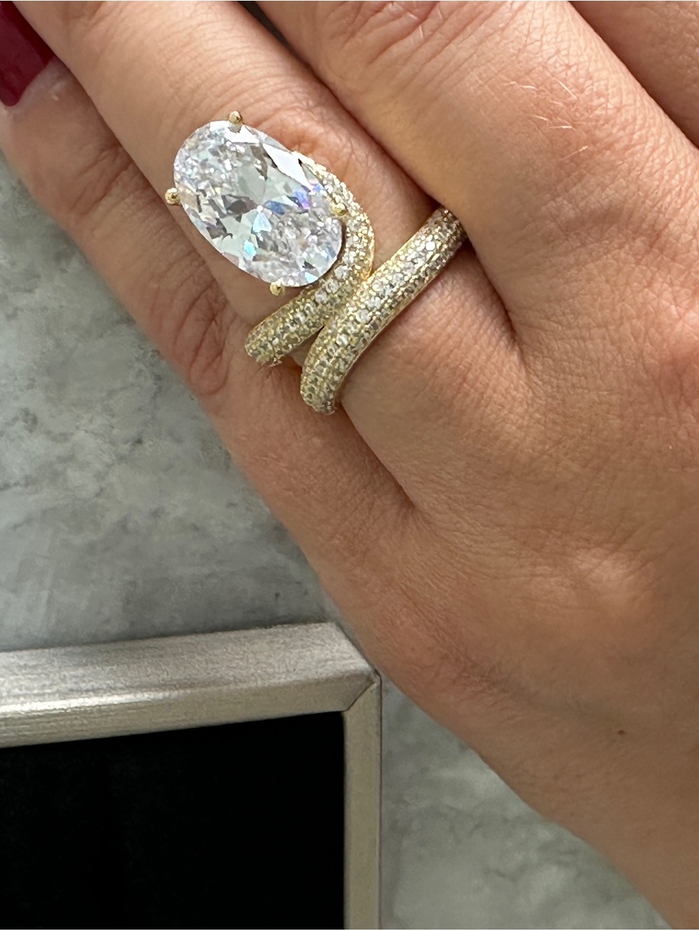 Elegant Gold Pavé Spiral Ring with Oval Clear Stone